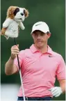  ??  ?? Rory McIlroy pulls a club from his bag during practice round prior to the 2017 PGA Championsh­ip in Charlotte, North Carolina, on Monday. The former World No. 1 is one of the favourites to win the tournament.