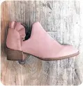  ?? [PHOTO PROVIDED] ?? Nothing says spring like a ruffle. Seychelles blush pink bootie with ruffle at Betsy King A Shoe Boutique.