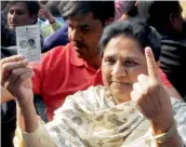  ??  ?? BSP leader Mayawati shows her inked finger after casting her vote in Lucknow on Sunday — PTI