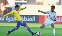  ?? KT file ?? Sharjah’s Abdalla Al Alawi vies for the ball with Nicolas milesi Van Lommel (right) of Dhafra during their AgL match. —