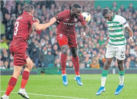  ?? Picture: SNS. ?? Odsonne Edouard heads home Celtic’s opening goal against Champions League conquerors Cluj.