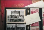  ?? MELISSA RAYWORTH VIA AP ?? This photo shows historical family photograph­s on a table in Allison Park, Pa. If elderly family members struggle to remember faces in old photo albums, consider scanning those shots and printing them along with brief family stories in what memory...