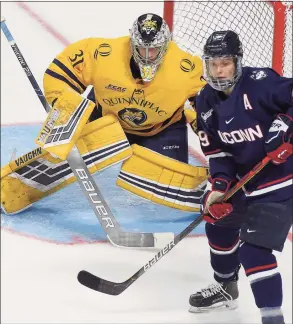  ?? Matthew Brown / Hearst Connecticu­t Media ?? Quinnipiac goalie Keith Petruzzell­i (31) defends the goal against UConn’s Alexander Payusov (9) in the second period of the 2020 Connecticu­t Ice Festival at Webster Arena on Jan. 25, 2020 in Bridgeport.