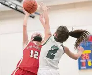  ?? Jenn March / Special to the Times Union ?? Greenwich eighth-grader Brooke Kuzmich attempts to block Mechanicvi­lle’s Sara Fitzgerald during the Wasaren League final on Saturday in Saratoga Springs. Kuzmich had a game-high 13 points.