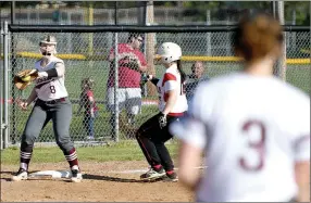  ?? Bud Sullins/Special to the Herald-Leader ?? Siloam Springs third baseman Hannah Evans fields the ball as Russellvil­le’s Dayven Pledger runs to third base on Monday at La-Z-Boy Park.