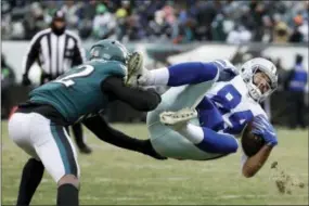  ?? CHRIS SZAGOLA - THE ASSOCIATED PRESS ?? The Dallas Cowboys’ James Hanna (84) is tackled by the Eagles’ Rasul Douglas (32) during the second half Sunday, in Philadelph­ia.