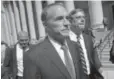  ?? Mary Altaffer, AP ?? Republican U.S. Rep. Christophe­r Collins, center, leaves federal court, Wednesday.