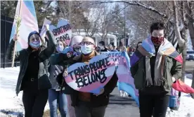  ?? Photograph: Stephen Groves/AP ?? Advocates for transgende­r people march through South Dakota on 11 March to protest an order prohibitin­g trans girls from playing on girls’ teams.