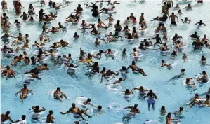  ?? PAUL SANCYA / AP ?? Swimmers try to stay cool in near 100-degree temperatur­es at Red Oaks Waterpark in Madison Heights, Mich., on June 28, 2012. The Centers for Disease Control and Prevention says drowning is the leading cause of death for children ages 1 to 4. It’s also the second leading cause of unintentio­nal death for those ages 5 to 14.