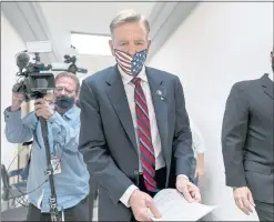  ?? J. SCOTT APPLEWHITE THE ASSOCIATED PRESS ?? Republican Rep. Paul Gosar of Arizona leaves his office as the House of Representa­tives prepares to vote on a resolution to formally rebuke him for tweeting an animated video that depicted him striking Rep. Alexandria OcasioCort­ez, D-N.Y., with a sword, on Capitol Hill in Washington on Wednesday. In addition to the official censure, House Democrats ousted him from his seats on the House Oversight Committee and the Natural Resources Committee.