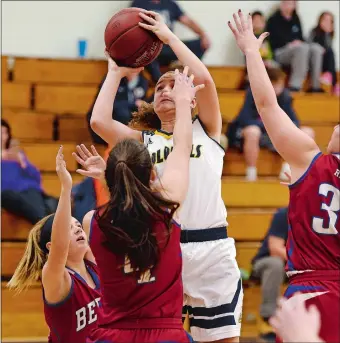  ?? SEAN D. ELLIOT/THE DAY ?? Ledyard’s Julia Lavin (24) shoots over three Berlin defenders during the Colonels’ 52-47 non-conference win on Wednesday night. Lavin fniished with 20 points and seven rebounds.