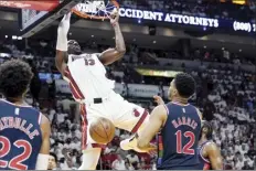  ?? AP photo ?? Heat center Bam Adebayo dunks over the 76ers’ Tobias Harris during the second half Wednesday.