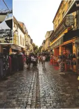  ??  ?? A busy shopping alley in Aigues Mortes