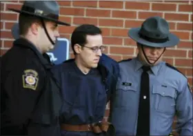  ?? BUTCH COMEGYS — THE TIMES & TRIBUNE VIA AP, FILE ?? Eric Frein is led away by Pennsylvan­ia State Police Troopers at the Pike County Courthouse after his preliminar­y hearing in Milford, Pa.