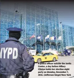  ??  ?? A police officer outside the Javits Center, a day before Hillary Clinton holds her election night party on Monday, November 7, 2016. (Jefferson Siegel/New York