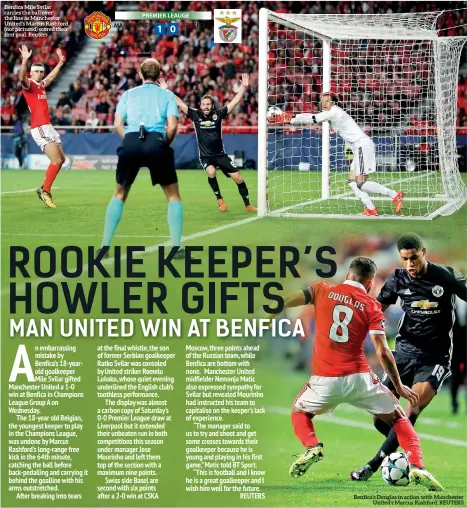  ??  ?? Benfica Mile Svilar carries the ball over the line as Manchester United’s Marcus Rashford (not pictured) scored their first goal. Reuters Benfica’s Douglas in action with Manchester United’s Marcus Rashford. REUTERS