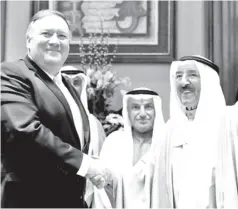  ?? — AFP photo ?? Pompeo (left) is welcomed by Emir Sheikh Sabah (right) in Kuwait City.