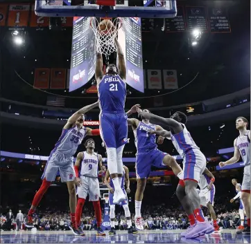  ?? MATT SLOCUM — THE ASSOCIATED PRESS ?? Joel Embiid scored 30points in his return from a shoulder injury as the 76ers routed the Pistons on Wednesday night.