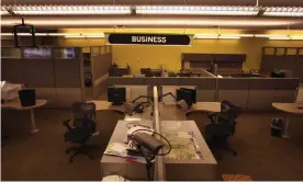  ?? Photograph: John Moore/Getty Images ?? A section of the Rocky Mountain News newsroom sits empty in Denver, Colorado. Colorado’s oldest newspaper closed in 2009.