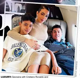  ?? NETFLIX/WIREIMAGE ?? Georgina with Cristiano Ronaldo and
Cristiano Jr. Above: Her show beamed on to Dubai’s Burj Khalifa Tower