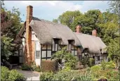  ?? CAMERON HEWITT/RICK STEVES’ EUROPE ?? The Hathaway family cottage in Shottery is where Shakespear­e’s wife, Anne, grew up. The couple’s courtship began on the property, which features a sculpture garden.