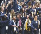  ?? Signal file photo ?? Graduating seniors toss their caps as they celebrate at the 2019 Academy of the Canyons commenceme­nt ceremony in Valencia. Due to COVID-19, the William S. Hart Union High School District is planning for virtual graduation ceremonies for all district schools this year.