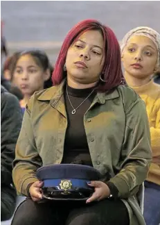  ?? Picture: WERNER HILLS ?? DEVASTATIN­G LOSS: Ammarentia Nel, the wife of slain court orderly Sergeant Mario Nel, at his memorial service at the Raymond Mhlaba Sport Centre yesterday