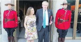  ??  ?? Foreign Affairs Minister Chrystia Freeland welcomes British Foreign Secretary Boris Johnson before a reception for G7 foreign ministers at the Royal Ontario Museum in Toronto.