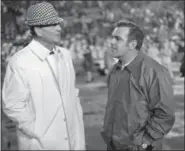  ?? JOE RAYMOND - THE ASSOCIATED PRESS ?? In this Dec. 31, 1973, file photo, Alabama coach Paul “Bear” Bryant, left, talks with Notre Dame coach Ara Parseghian prior to the Sugar Bowl college football game, in New Orleans, La.
