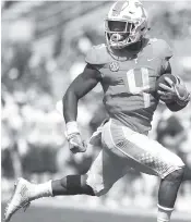  ?? STAFF FILE PHOTO BY ROBIN RUDD ?? Running back John Kelly is skipping his senior season at Tennessee, hopeful he will be signed by an NFL team instead. The draft starts tonight in Arlington, Texas.