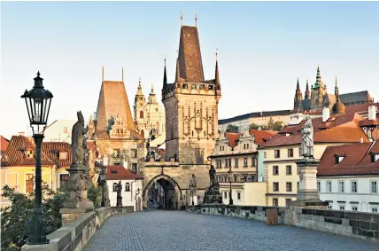  ??  ?? The thinking man’s attraction: the Charles Bridge in Prague is lined with statues of philosophe­rs and impressed Moby, below left, when he visited