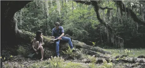  ?? MICHELE K. SHORT/SONY PICTURES VIA AP ?? This image released by Columbia Pictures shows Daisy Edgar-Jones (left) and Taylor John Smith in a scene from “Where the Crawdads Sing.”