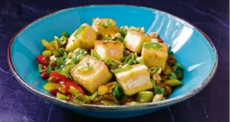  ?? KAROLINE BOEHM GOODNICK FOR THE BOSTON GLOBE ?? Top: Baked Tofu. Above: Stir-Fried Celery with Crispy Tofu.