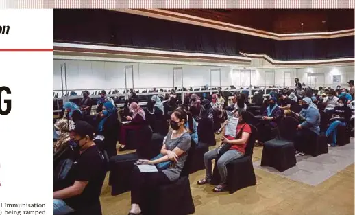  ?? BERNAMA PIC ?? People waiting to be vaccinated at the vaccine delivery centre in the World Trade Centre Kuala Lumpur yesterday.