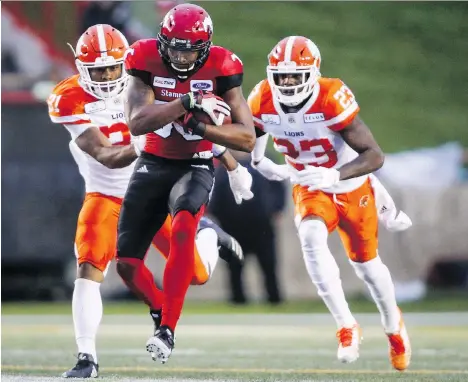  ?? JEFF McINTOSH/THE CANADIAN PRESS ?? Lions defensive backs Otha Foster III, left, and Anthony Thompson chase Calgary Stampeders slotback Kamar Jorden during a West Division game earlier this month in Calgary.