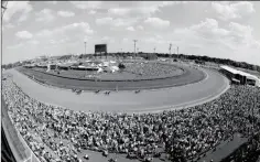  ?? ASSOCIATED PRESS ?? IN THIS MAY 2, 2015, FILE PHOTO, taken with a fisheye lens, fans watch a race before the 141st running of the Kentucky Derby at Churchill Downs in Louisville, Ky. Churchill Downs’ parent company has pumped $250 million into renovation­s since the early...