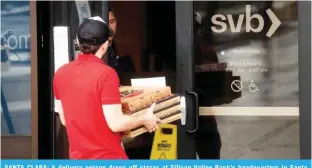  ?? ?? SANTA CLARA: A delivery person drops off pizzas at Silicon Valley Bank’s headquarte­rs in Santa Clara, California. — AFP