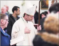  ?? Tyler Sizemore / Hearst Connecticu­t Media file photo ?? Bishop of the Diocese of Bridgeport Frank Caggiano enters Mass at St. Catherine of Siena Church in the Riveride section of Greenwich on Nov. 24, 2019. A statement posted to the Diocese website Wednesday said Caggiano, who has tested positive for coronaviru­s, is asymptomat­ic and is feeling well.