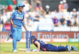  ??  ?? England's Heather Knight is run out during the ICC Women's World Cup fixture against India on Saturday.