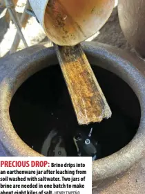  ?? HENRY EMPEÑO ?? PRECIOUS DROP: Brine drips into an earthenwar­e jar after leaching from soil washed with saltwater. Two jars of brine are needed in one batch to make about eight kilos of salt.