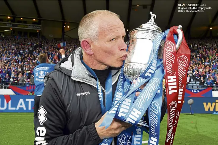  ?? ?? DAY TO SAVOUR: John Hughes lifts the trophy with Caley Thistle in 2015.