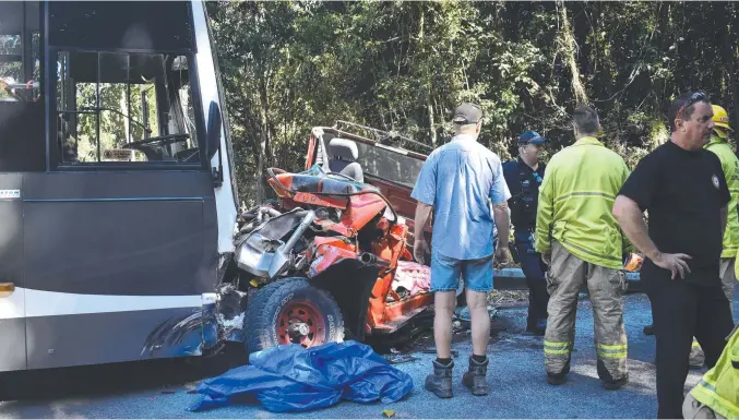  ??  ?? Hinchinbro­ok emergency responders at the scene of a bus and ute collision which left the ute driver with serious injuries. Picture: Cameron Bates