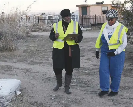  ?? Valley Press files ?? KEEPING COUNT — Volunteers Shirley Love, left, of Lancaster and Joshie Jacobs of Palmdale canvass a field east of Sierra Highway and north of Columbia Way (Avenue M) as they take a census of the homeless and their encampment­s during the 2018 Greater Los Angeles Homeless Count in Lancaster.