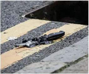  ??  ?? Bloodbath... police photo, right, of the suspect. Left, a knife, lies in the road, but police do not know yet whether it was used in the Birmingham attacks that ended in Hurst Street, below, where forensic officers are trying to puzzle out the macabre chain of events