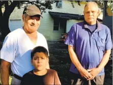  ?? Dan Haar / Hearst Connecticu­t Media ?? Flavio Canelas, left, from Honduras, with his grandson Emmanuel, 7, and Juan Mejia, fromEl Salvador. The two men live in Bridgeport under the Temporary Protected Status program and work as building cleaners in Norwalk with 32BJ SEIU.