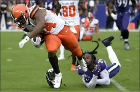  ?? NICK WASS - THE ASSOCIATED PRESS ?? FILE - In this Sept. 29, 2019, file photo, Cleveland Browns running back Nick Chubb (24) avoids a tackle by Baltimore Ravens cornerback Maurice Canady (26) while running for a touchdown during the second half of an NFL football game in Baltimore.