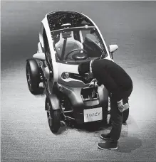  ?? CHRIS RATCLIFFE BLOOMBERG ?? Renault continues to gain momentum with its Twizy, a jewel box of a four-wheeled electric vehicle that it’s made since 2012.