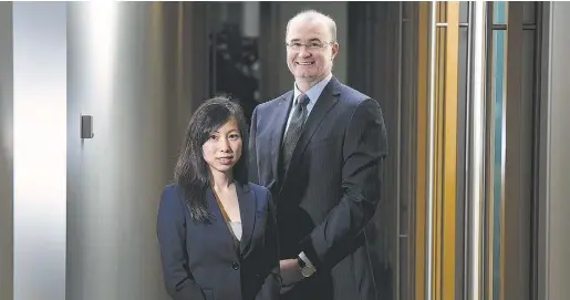  ?? Da rren Calabrese / National Post ?? From left, Vivian Lo and Andrew Hamlin, co-vice presidents and portfolio managers at Aston Hill Asset Management, became bullish on the consumer discretion­ary space last year as oil prices started falling
because they thought lower gasoline prices...