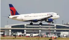  ?? AP FILE PHOTO/TONY GUTIERREZ ?? A Delta plane makes its approach at Dallas-Fort Worth Internatio­nal Airport in Grapevine, Texas. Delta reported its first quarterly profit since the pandemic devastated the airline industry more than a year ago. Delta said Wednesday that it earned $652 million in the second quarter.