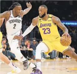  ?? GETTY ?? Taurean Prince and Nets beat LeBron James and Lakers on March 10, night before coronaviru­s pandemic shut down sports.